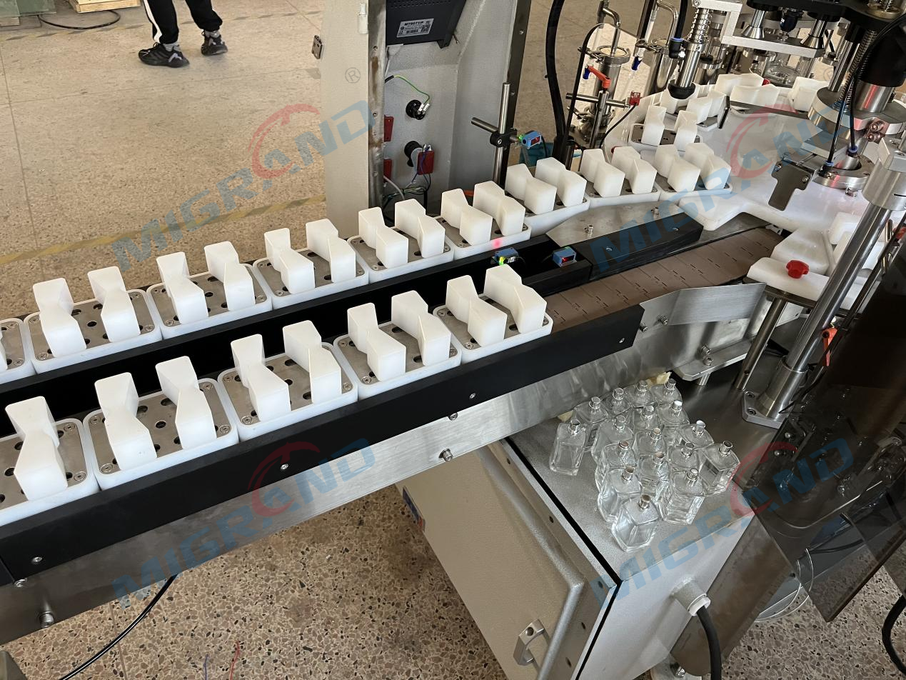 حزام ناقل تفريغ الزجاجة من آلة العطور فيل